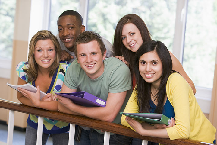 College students stood by staircase