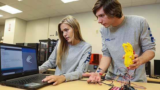 Engineer working on computer circuit