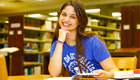 Picture of a student studying in the library