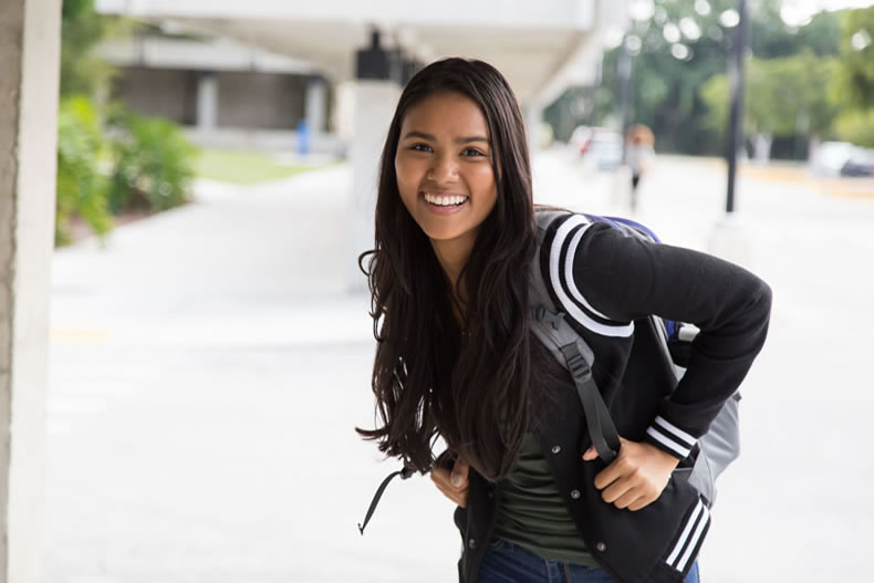 Smiling student with backpack