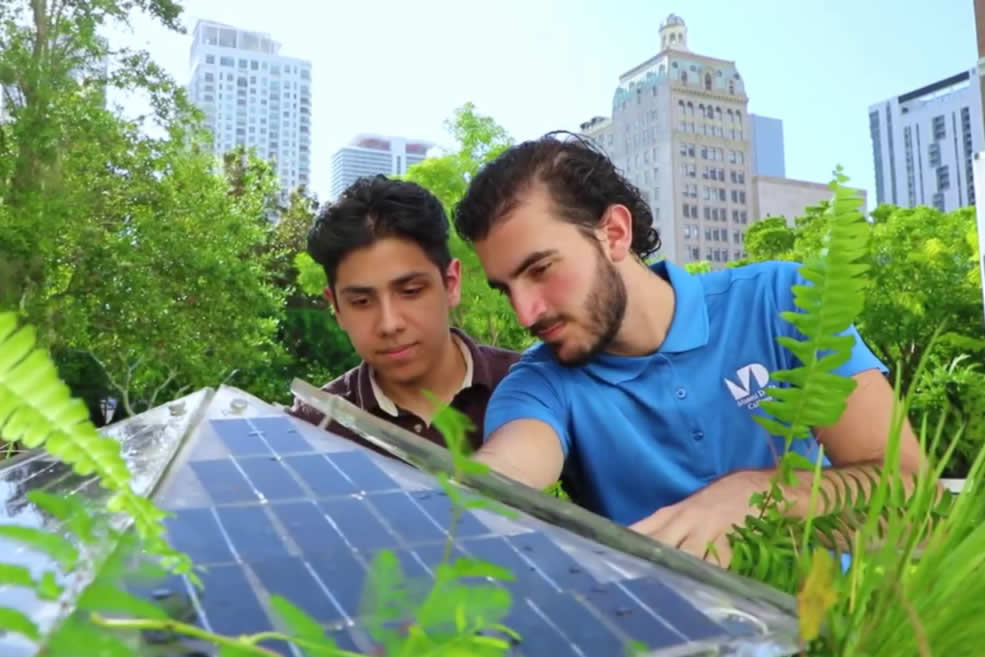 Manuel Marin working with a student