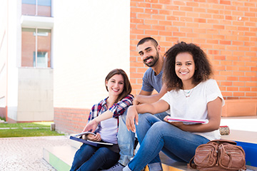 Three students studying outside