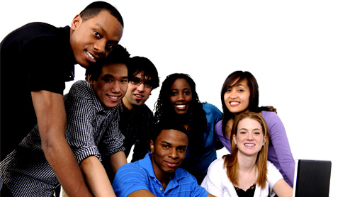 Students gathered around a laptop