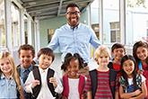 Teacher posing with his class