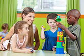 teacher and her students playing with toys