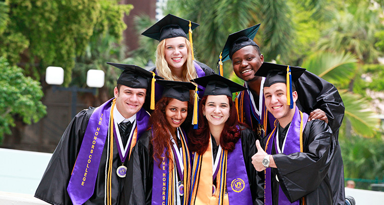 Group of graduates students wearing their cap and gown