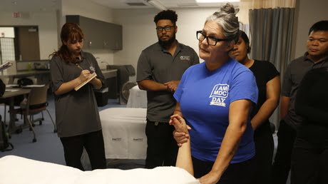 Medical Campus Therapies working on a patient's arm