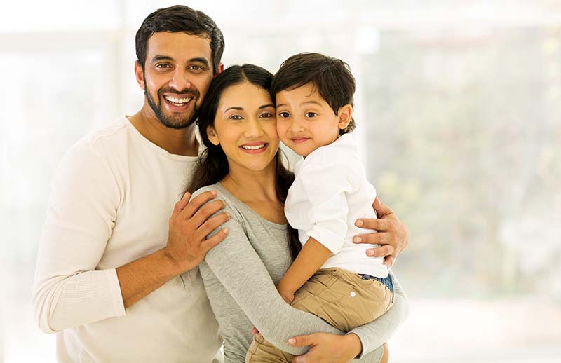 Man woman and child smiling