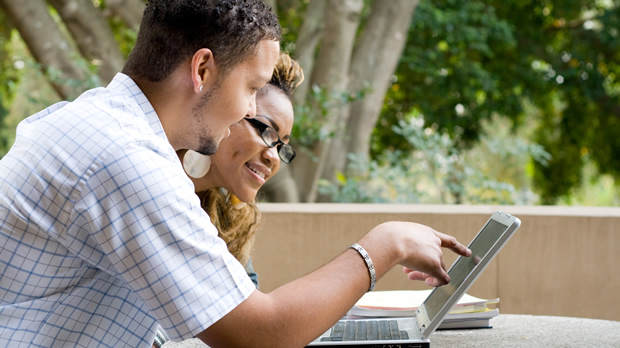 Students in front of a laptop